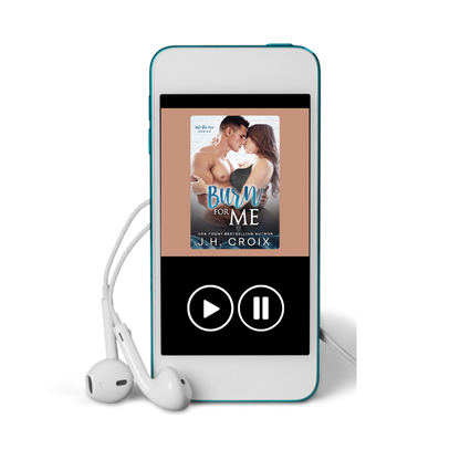 Blue digital audiobook player displaying 'Burn for Me' by J.H. Croix with white earbuds.