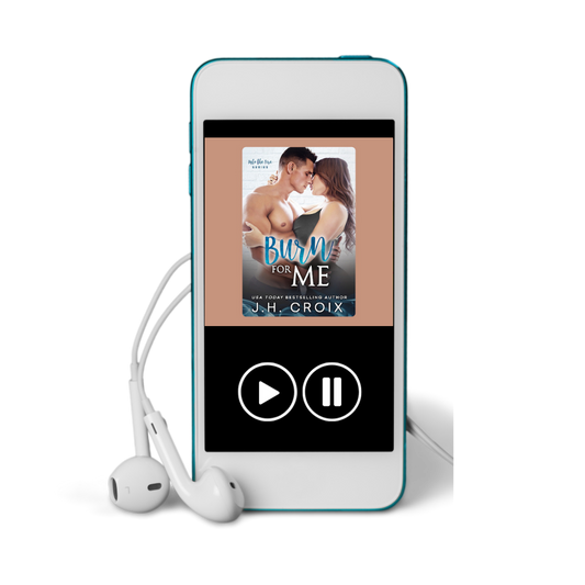 Blue digital audiobook player displaying 'Burn for Me' by J.H. Croix with white earbuds.