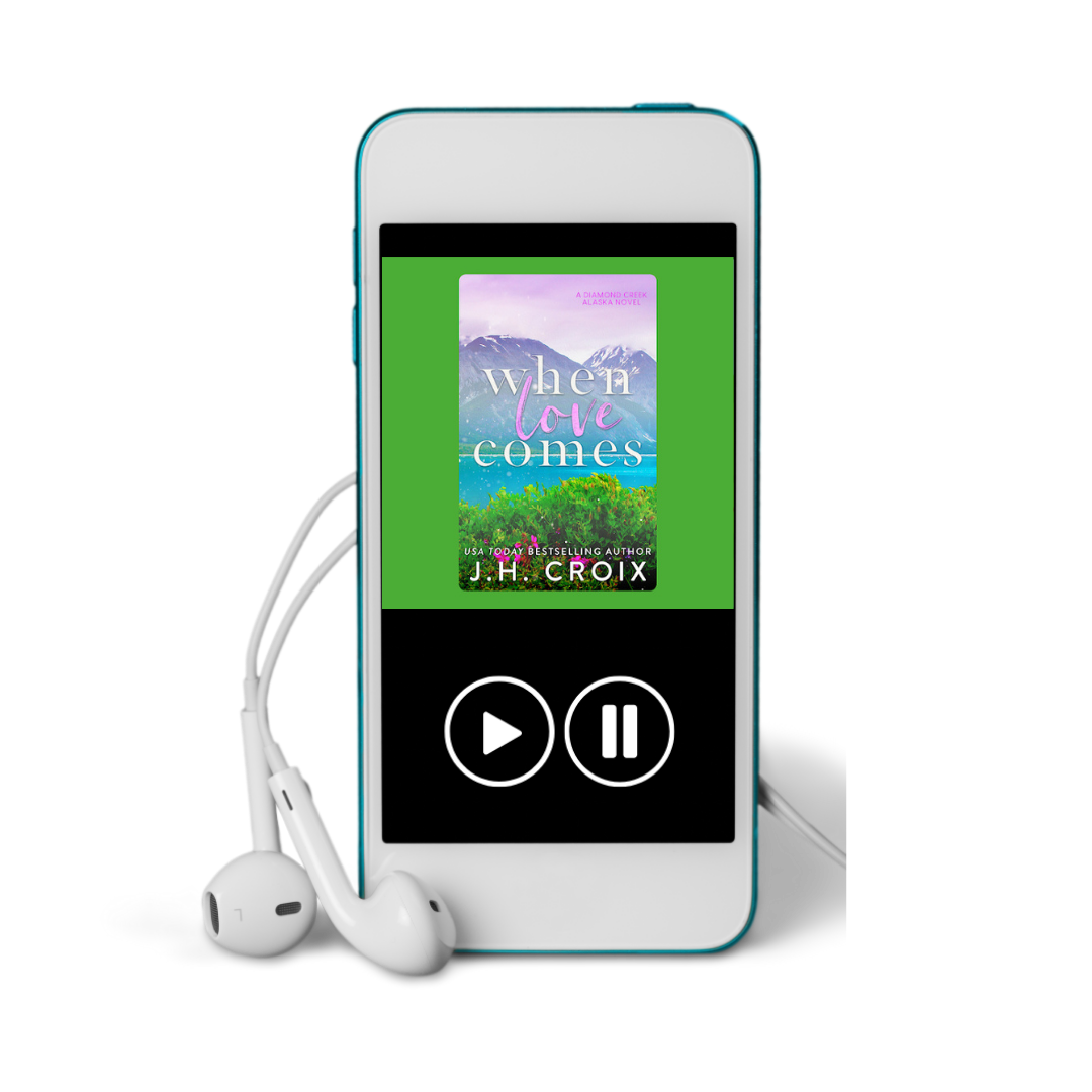 Blue digital audio player displaying 'When Love Comes' by J.H. Croix with white earbuds.
